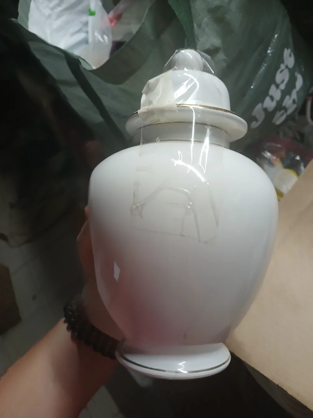 vintage Japanese white porcelain ginger jar featuring a metallic inlaid medallio